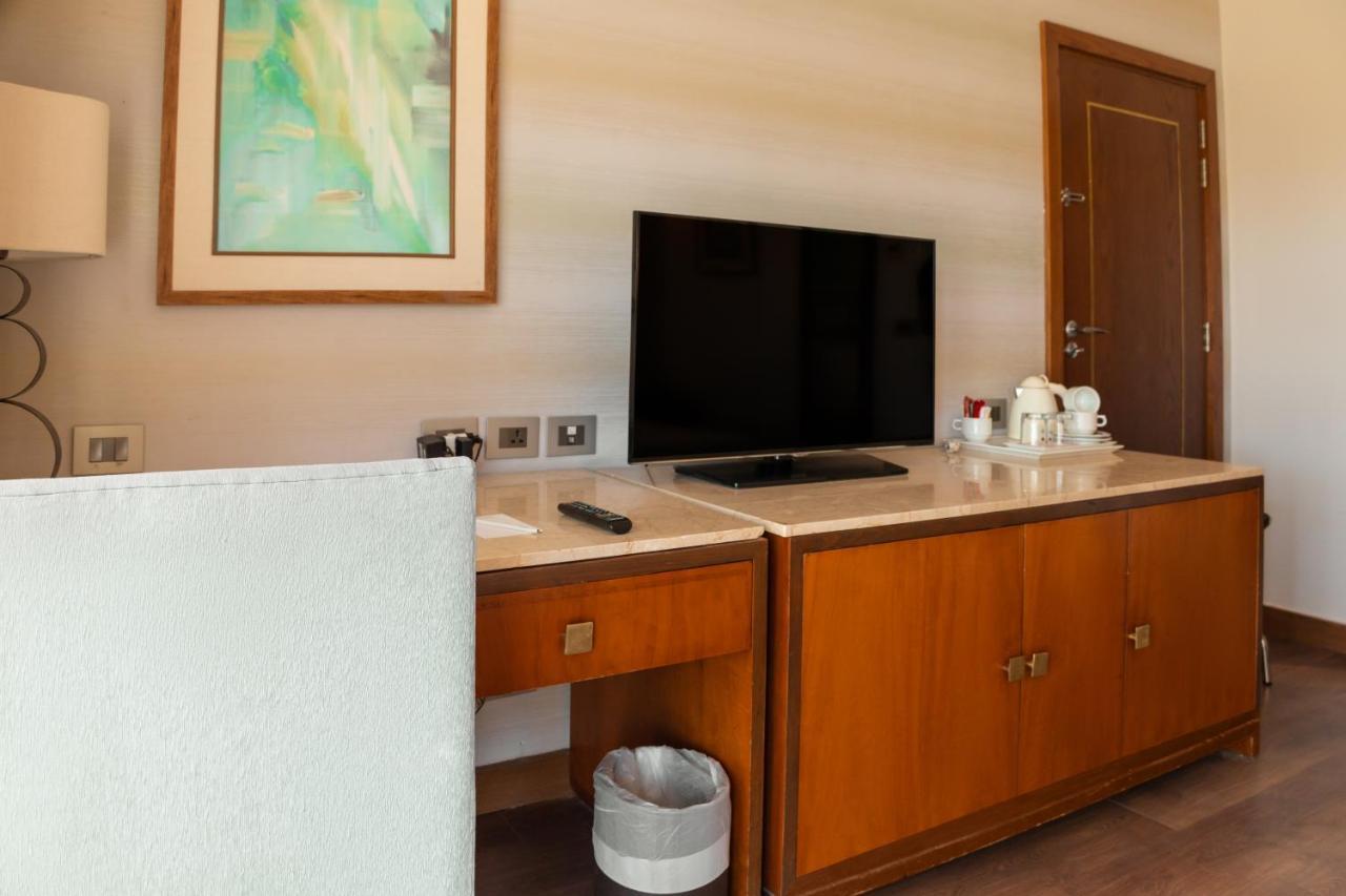 Sharm Dreams Vacation Club - Aqua Park Sharm El Sheikk Exterior foto A television in a hotel room